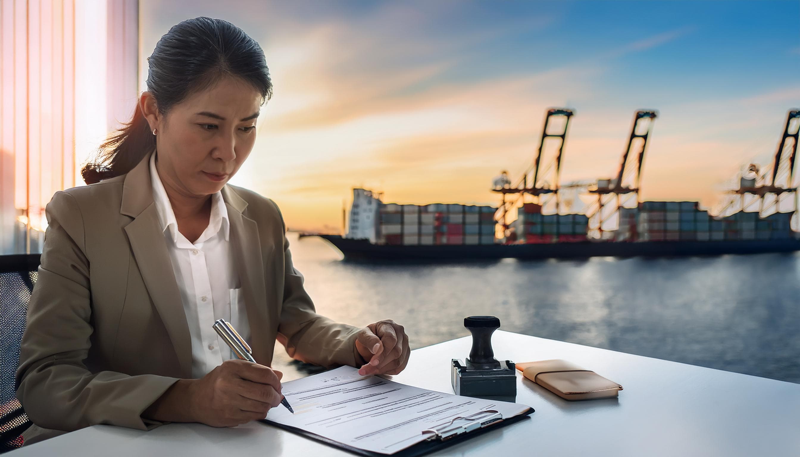 Businesswoman reviewing financial documents at port