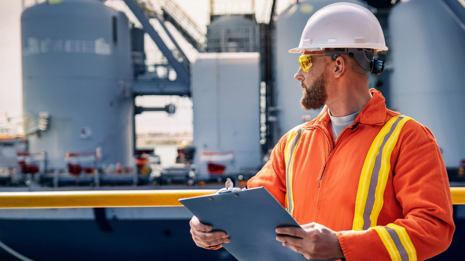 Engineer in safety gear managing fuel and provisions on a ship